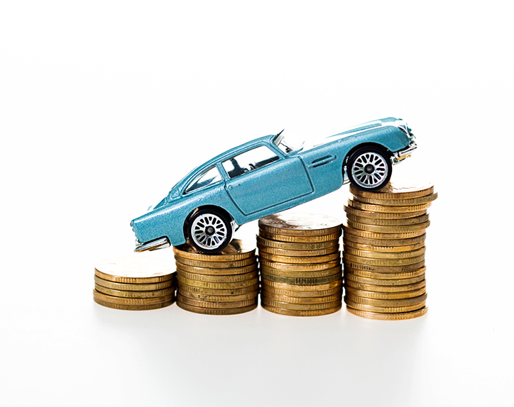 Blue toy car over many stacked coins against white background.