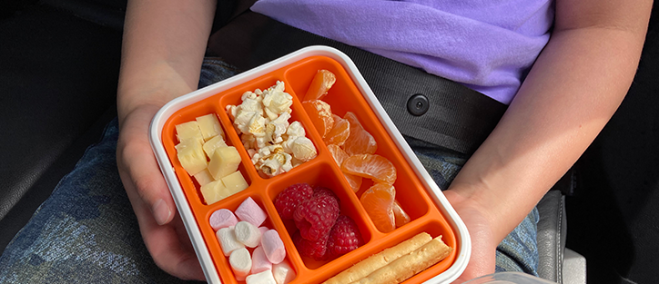 Plastic Tupperware with compartments with snacks in