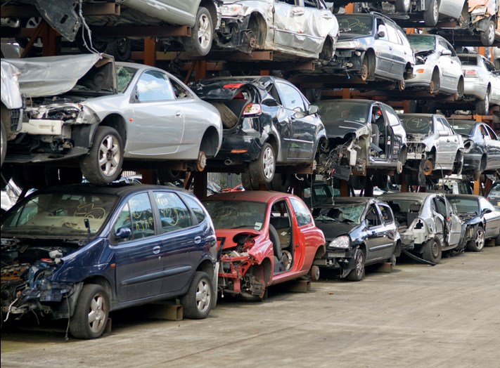 Depolluted scrap cars on racks ready to be recycled